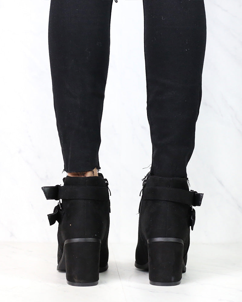 A Grand Entrance Faux Suede Ankle Bootie With Buckle Detail in More Colors