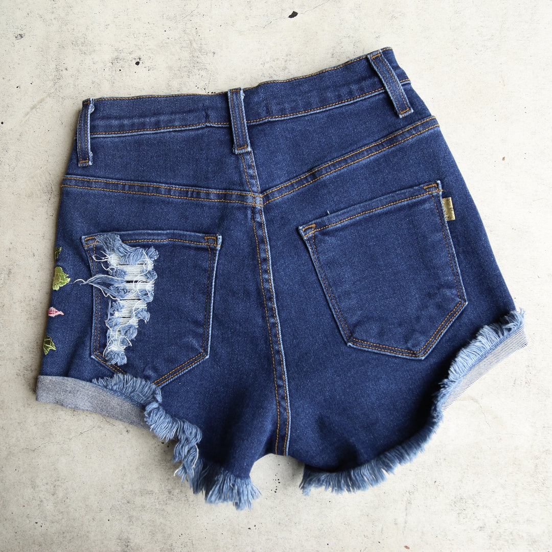 Final Sale - High Waisted Shredded Hot Shorts with Floral Applique in Dark Blue