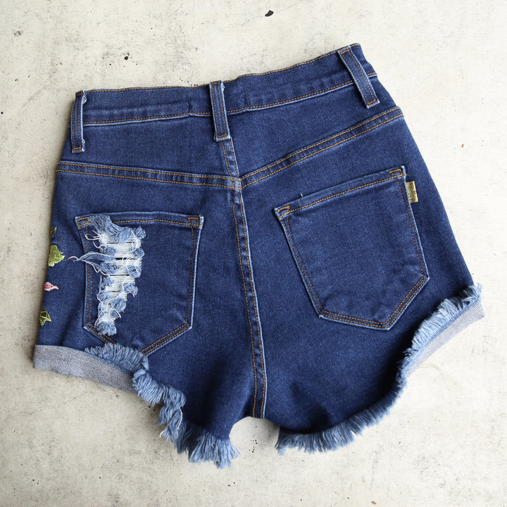 Final Sale - High Waisted Shredded Hot Shorts with Floral Applique in Dark Blue